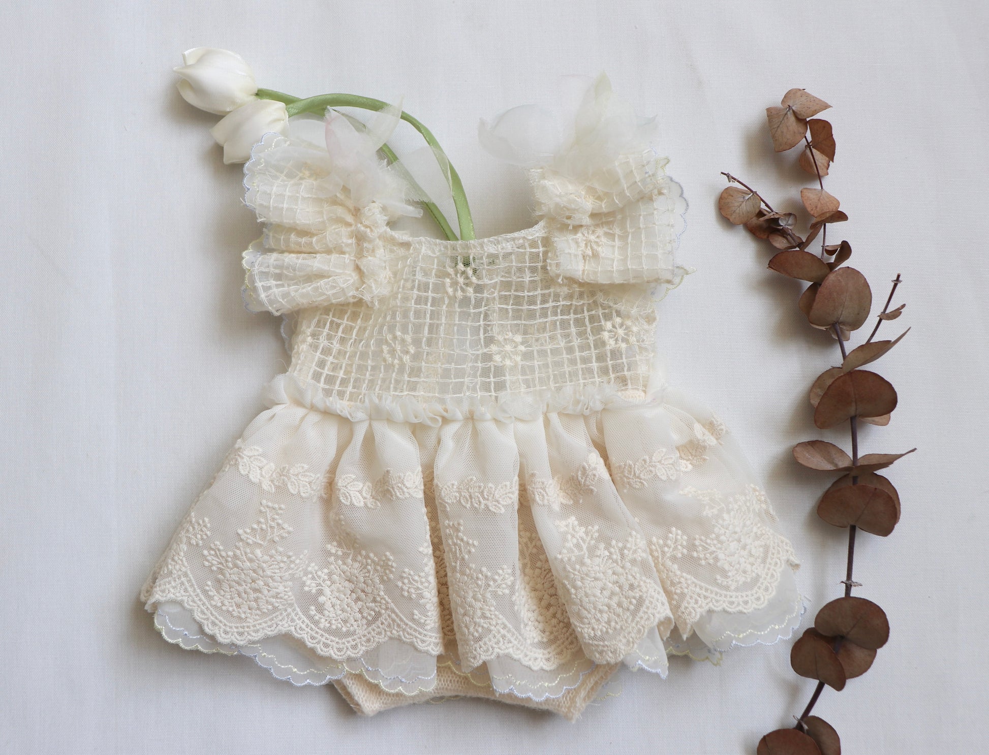 Ivory lace and chiffon baby girl romper with flower embroidery and soft tulip straps – perfect for newborn photography