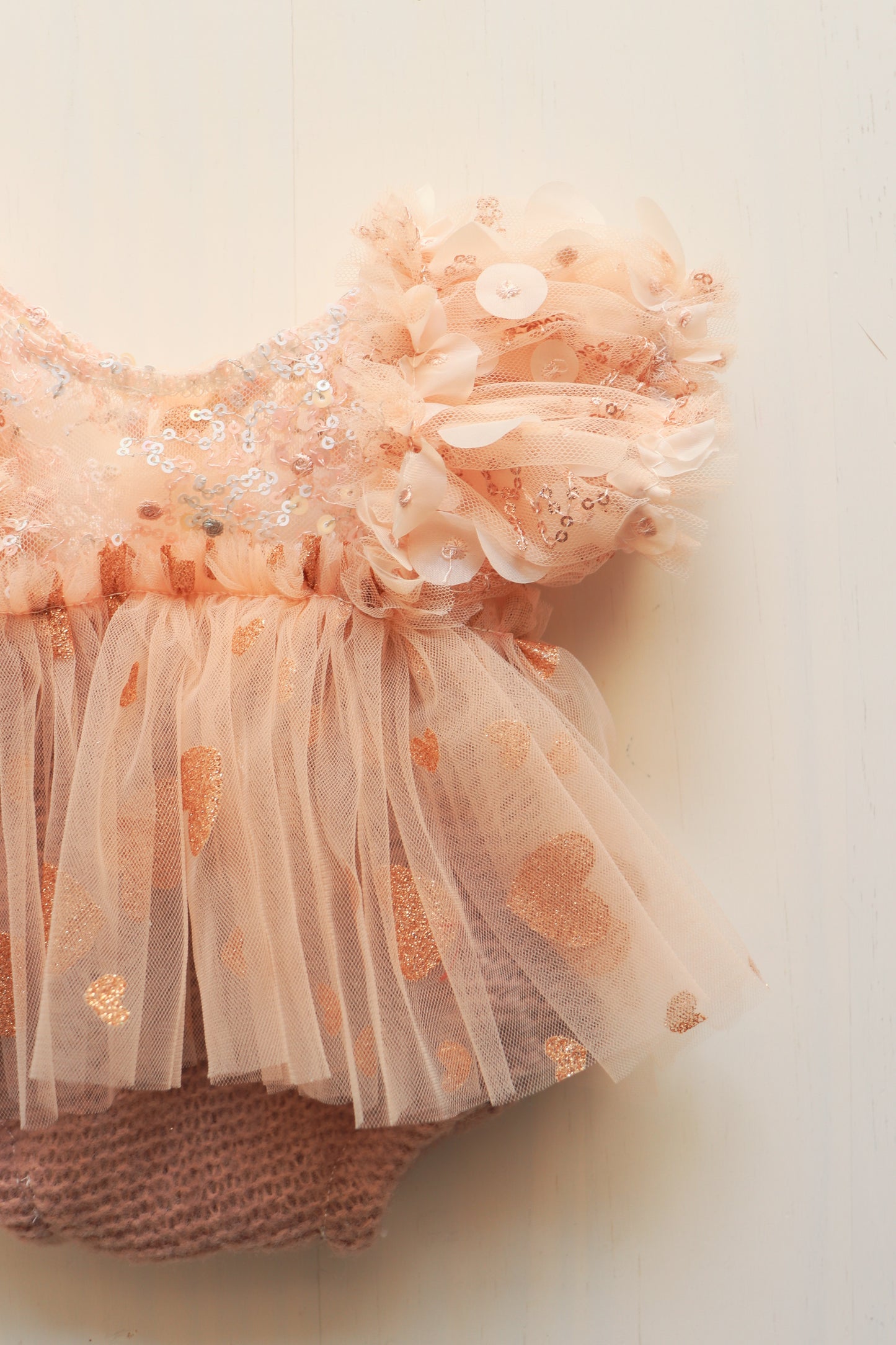 Newborn romper with colorful sequins on the bodice and golden rose heart tulle skirt