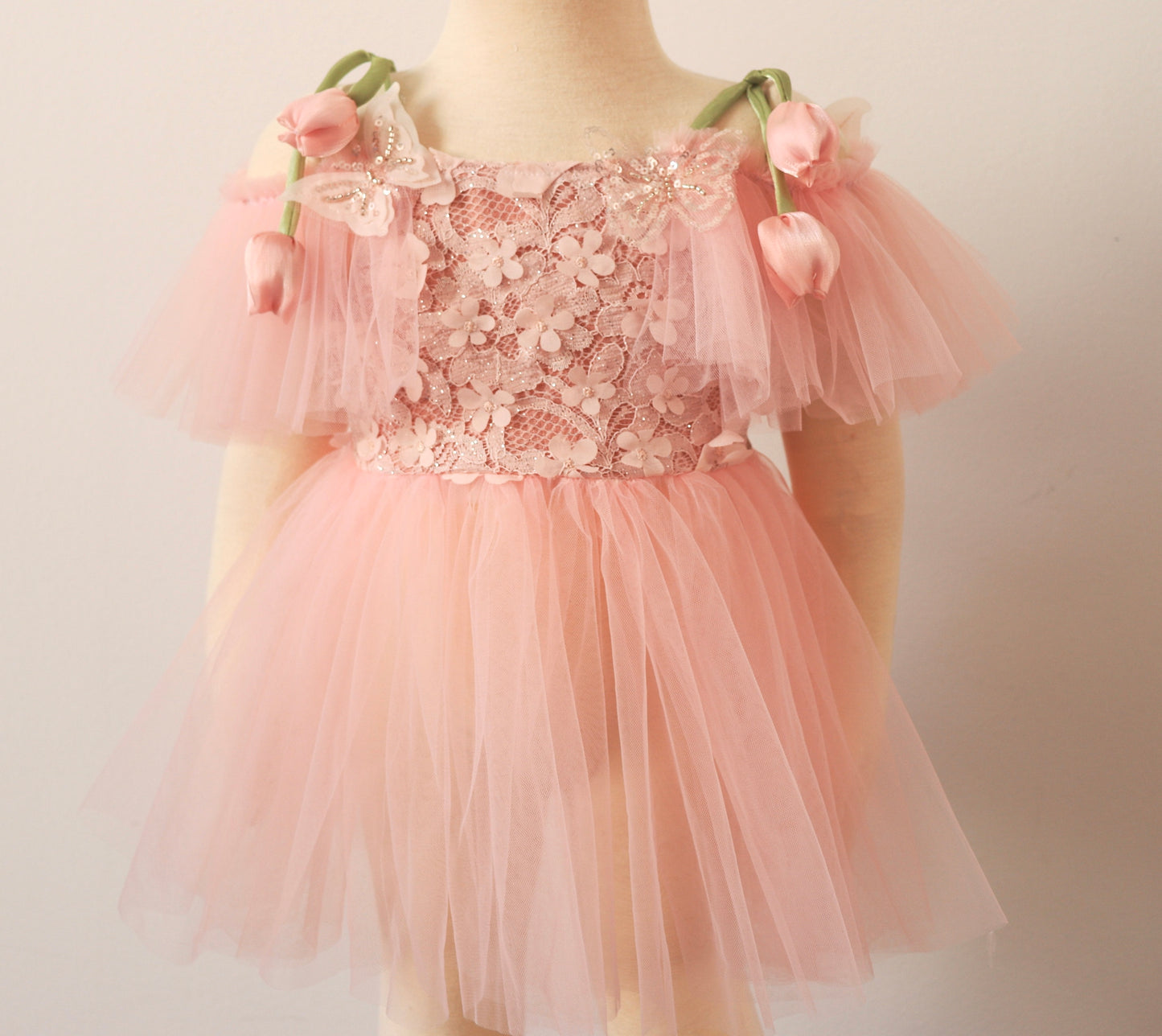 Fairy-inspired pink toddler dress with tulle skirt, tulip-style straps, and matching bloomer for special occasions