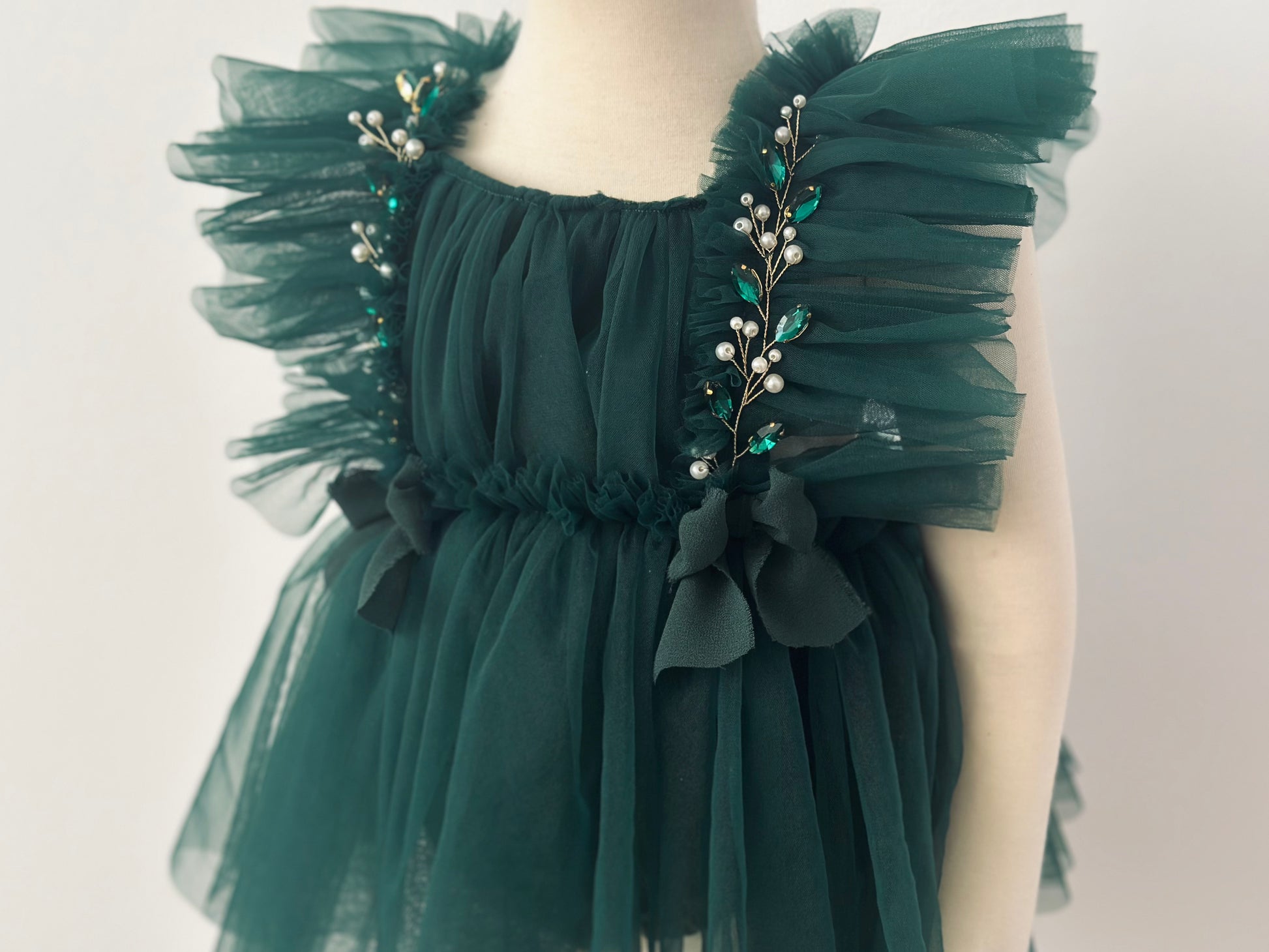 Evergreen tulle girl dress with pearl and green bead embellishments for evergreen girl dress photoshoot christmas session