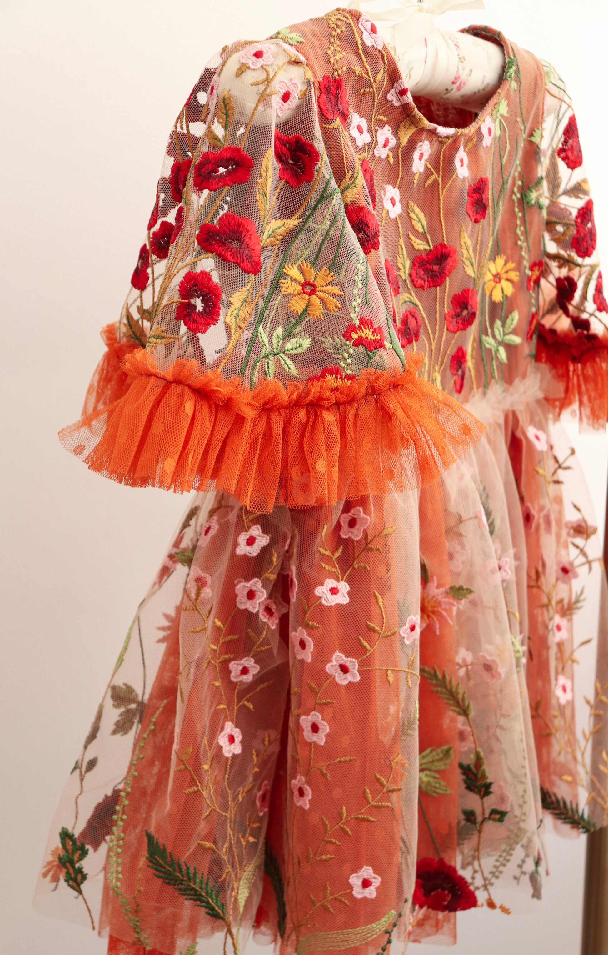 Girl embroidered photo prop dress with colorful floral embroidery and orange tulle ruffle sleeves