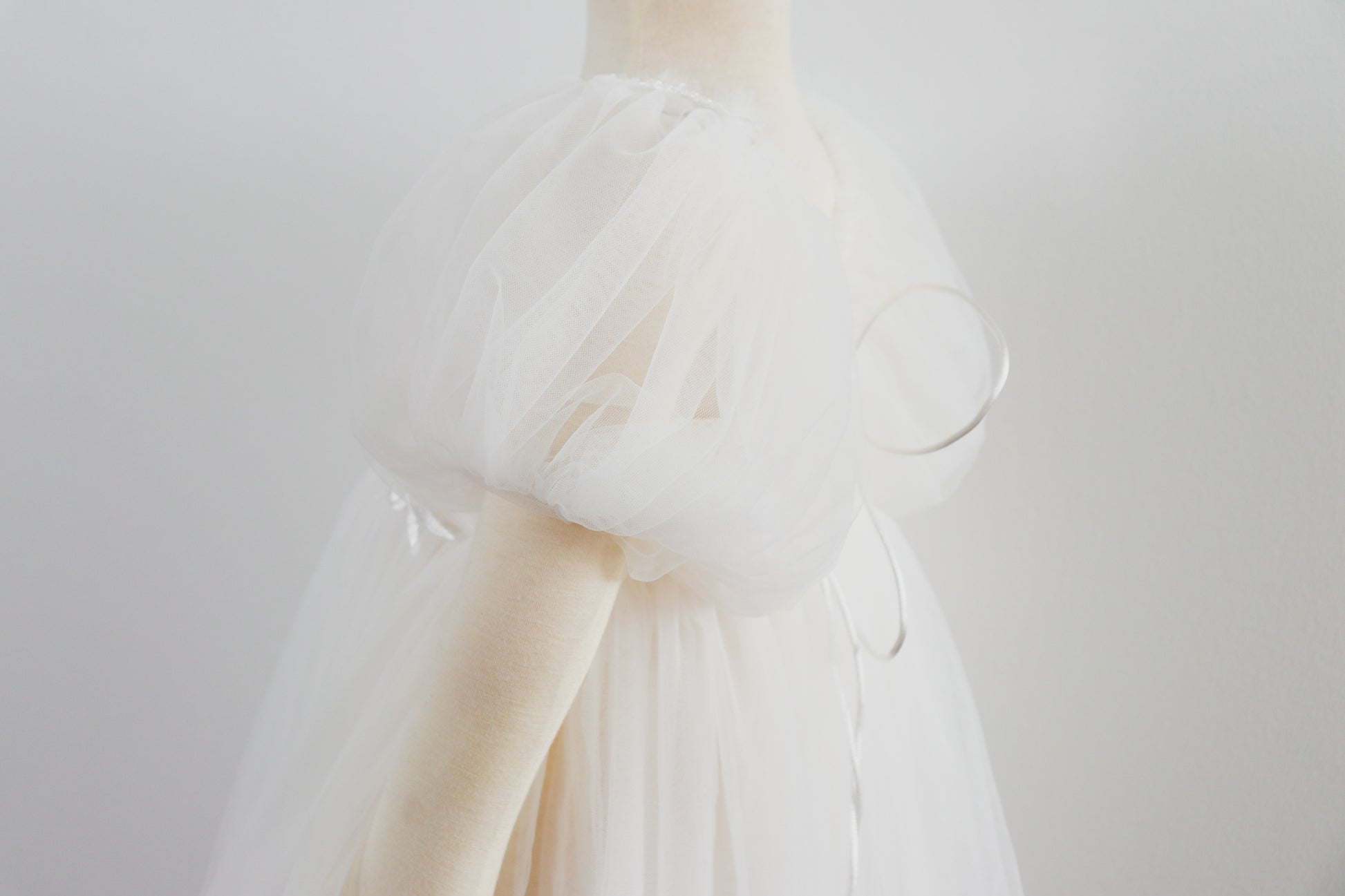 White delicate girl photo shoot dress with puff sleeves and sheer fabric by FLEUR MARGOT
