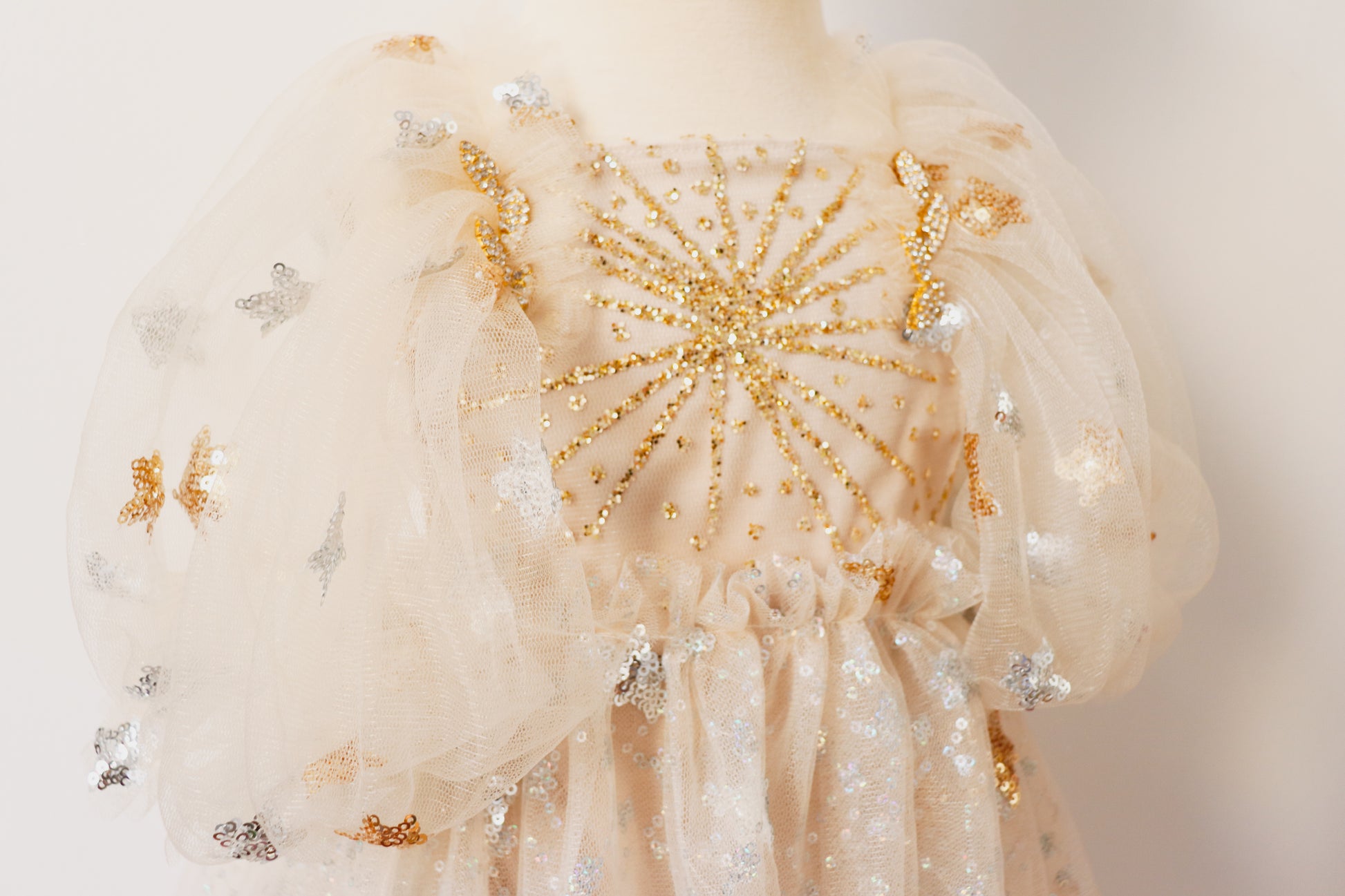 FLEUR MARGOT gold sequin baby dress with intricate gold and silver sequin detailing on puff sleeves and bodice