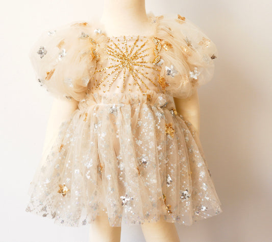 FLEUR MARGOT gold sequin baby dress with puffy sleeves and star embellishments on tulle fabric