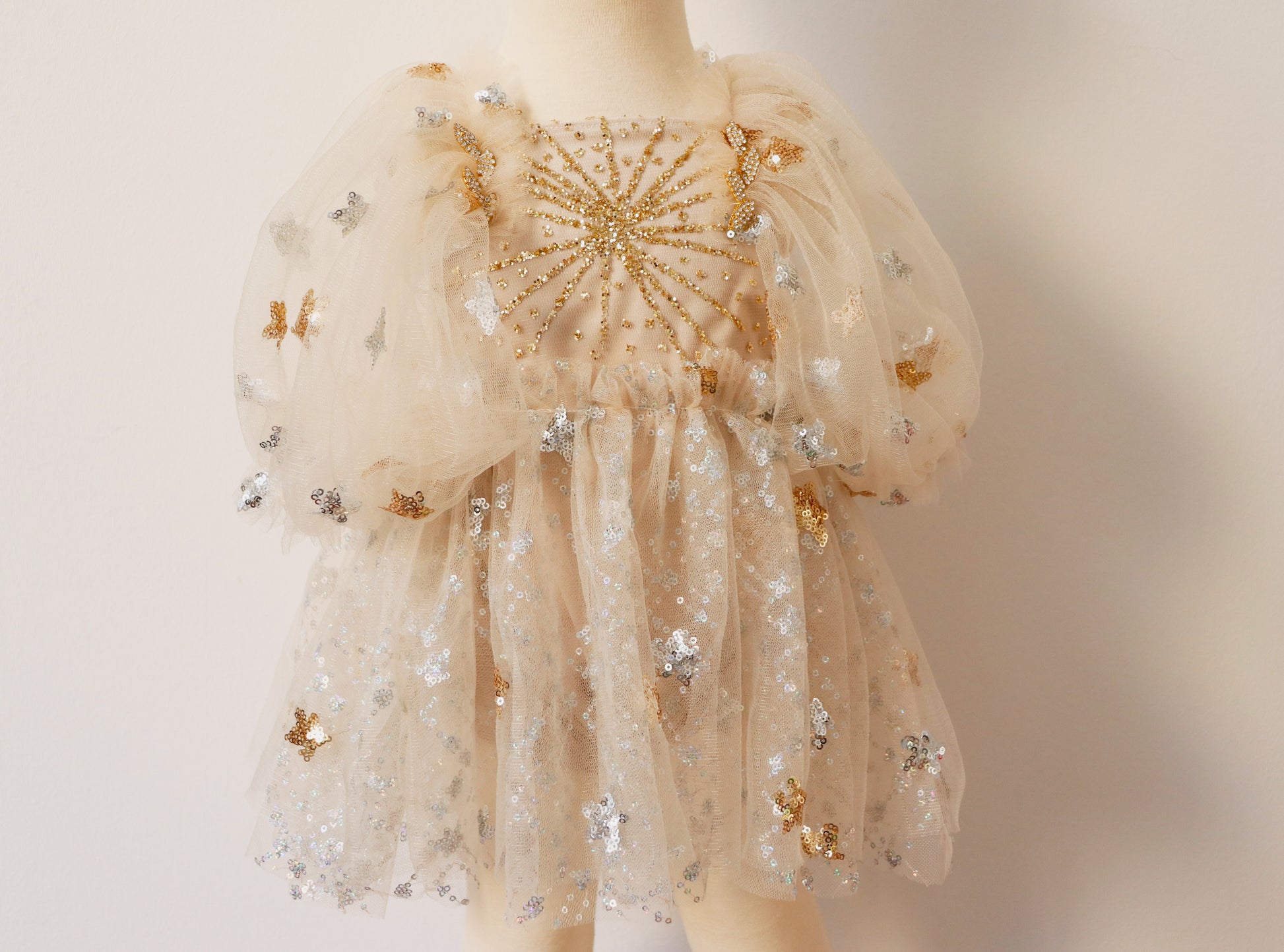 FLEUR MARGOT gold sequin baby dress with puff sleeves and star embellishments on tulle fabric