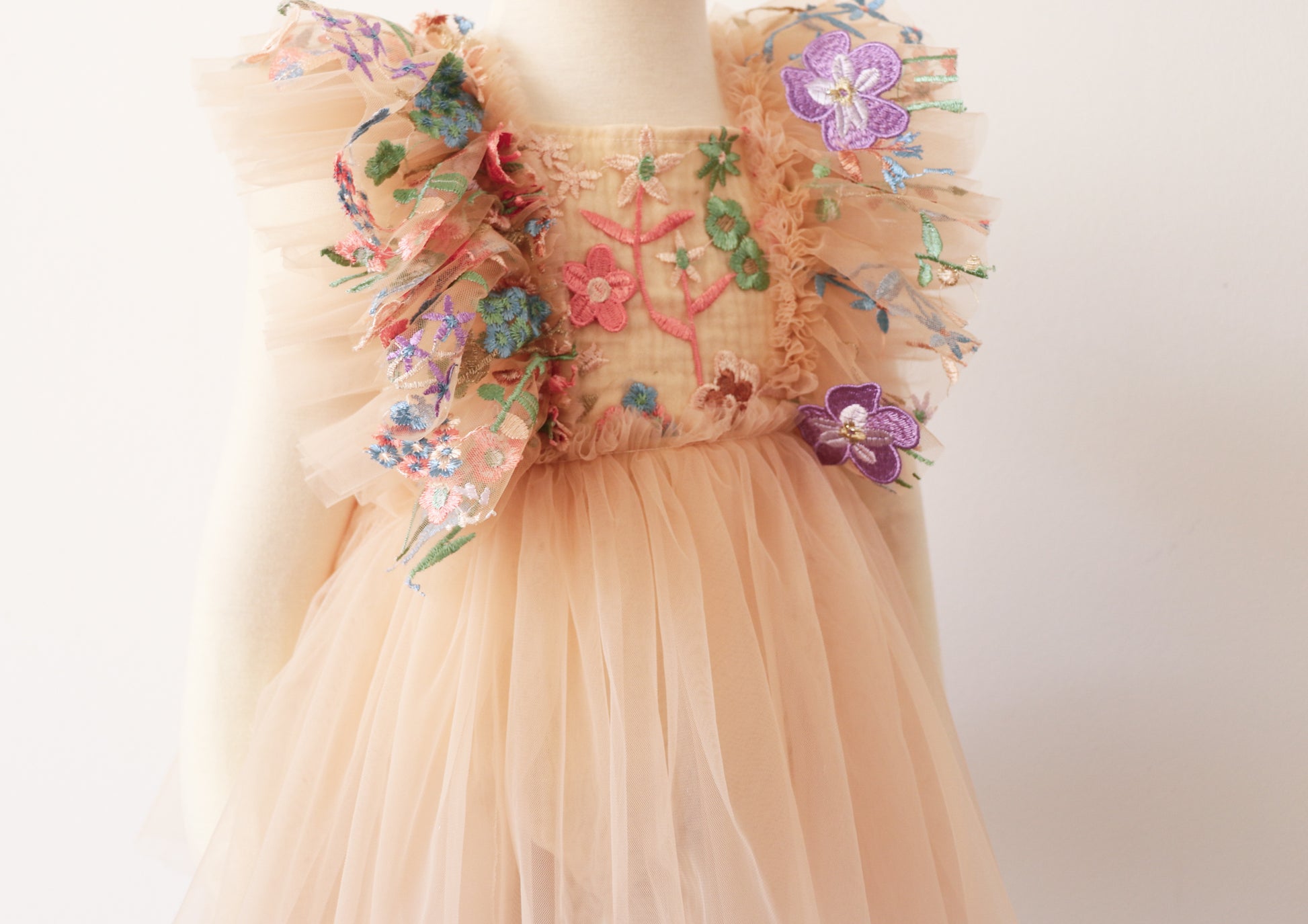 FLEUR MARGOT peach dress with floral embroidery and tulle ruffle detailing infant portrait session clothing