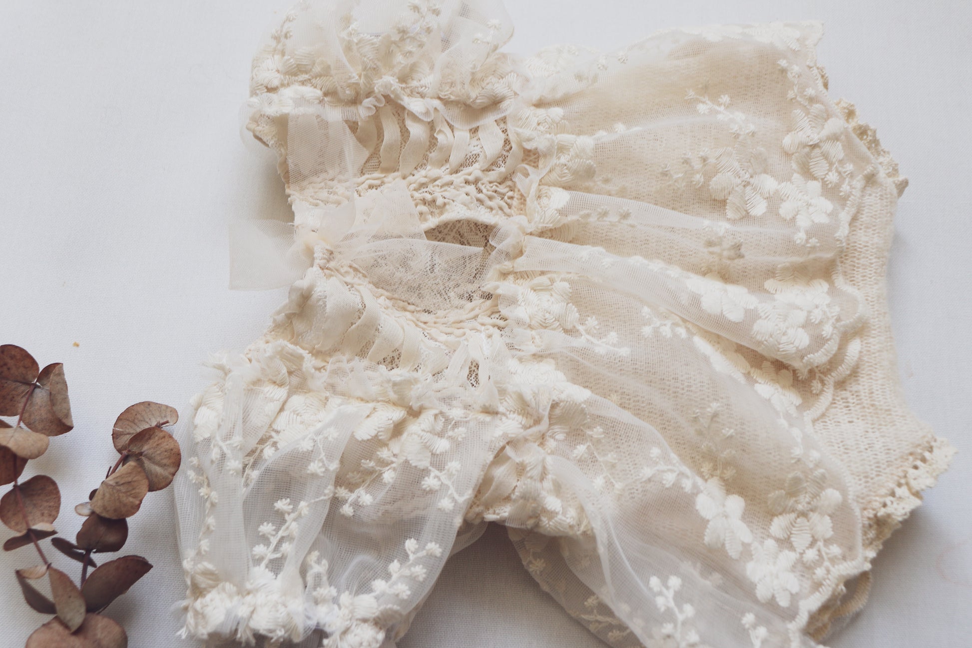 FLEUR MARGOT delicate lace newborn photo outfit with floral embroidery and puff sleeves in soft cream color