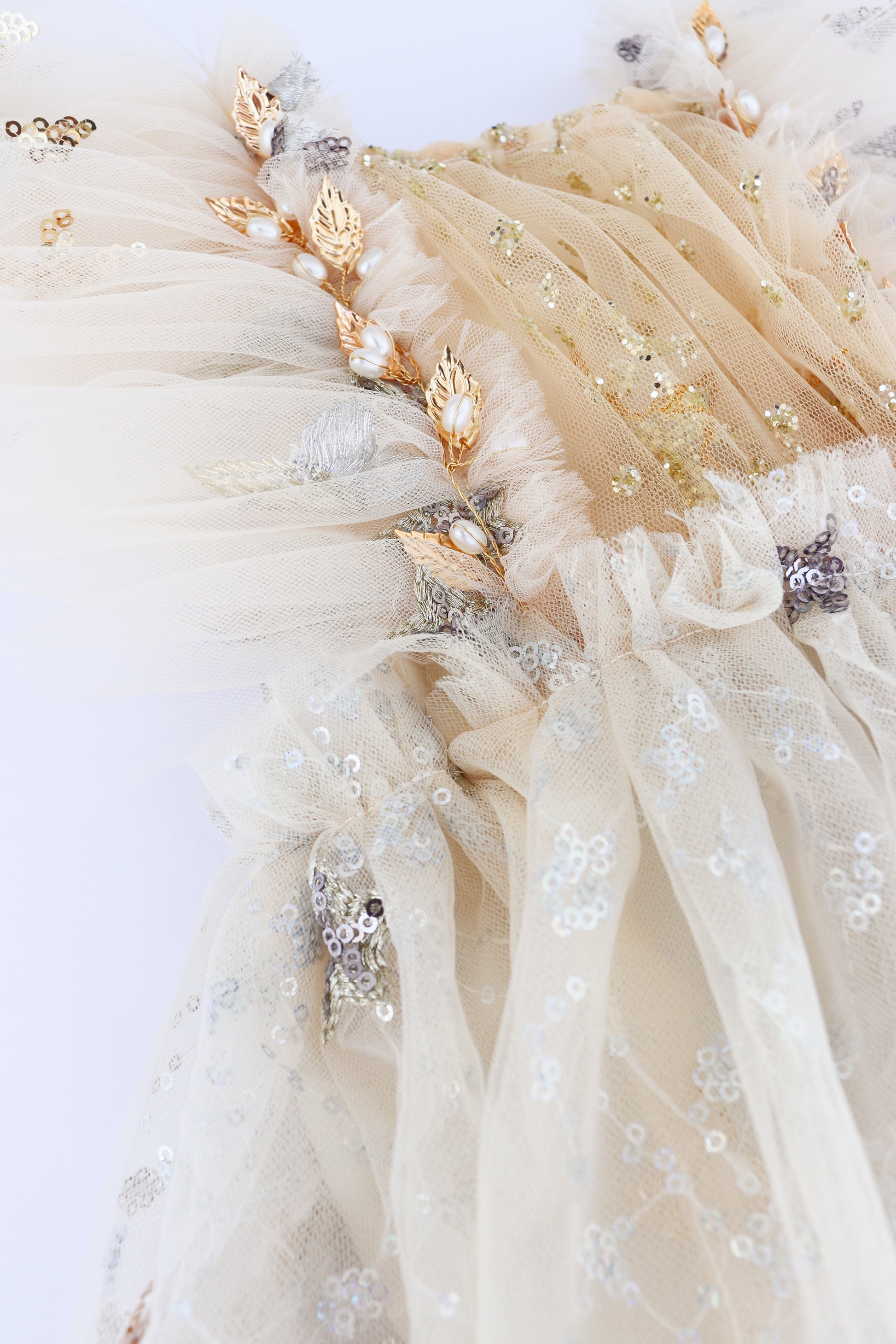 Cream tulle sitter session dress for photoshoots with gold leaf appliques sequins and ruffles