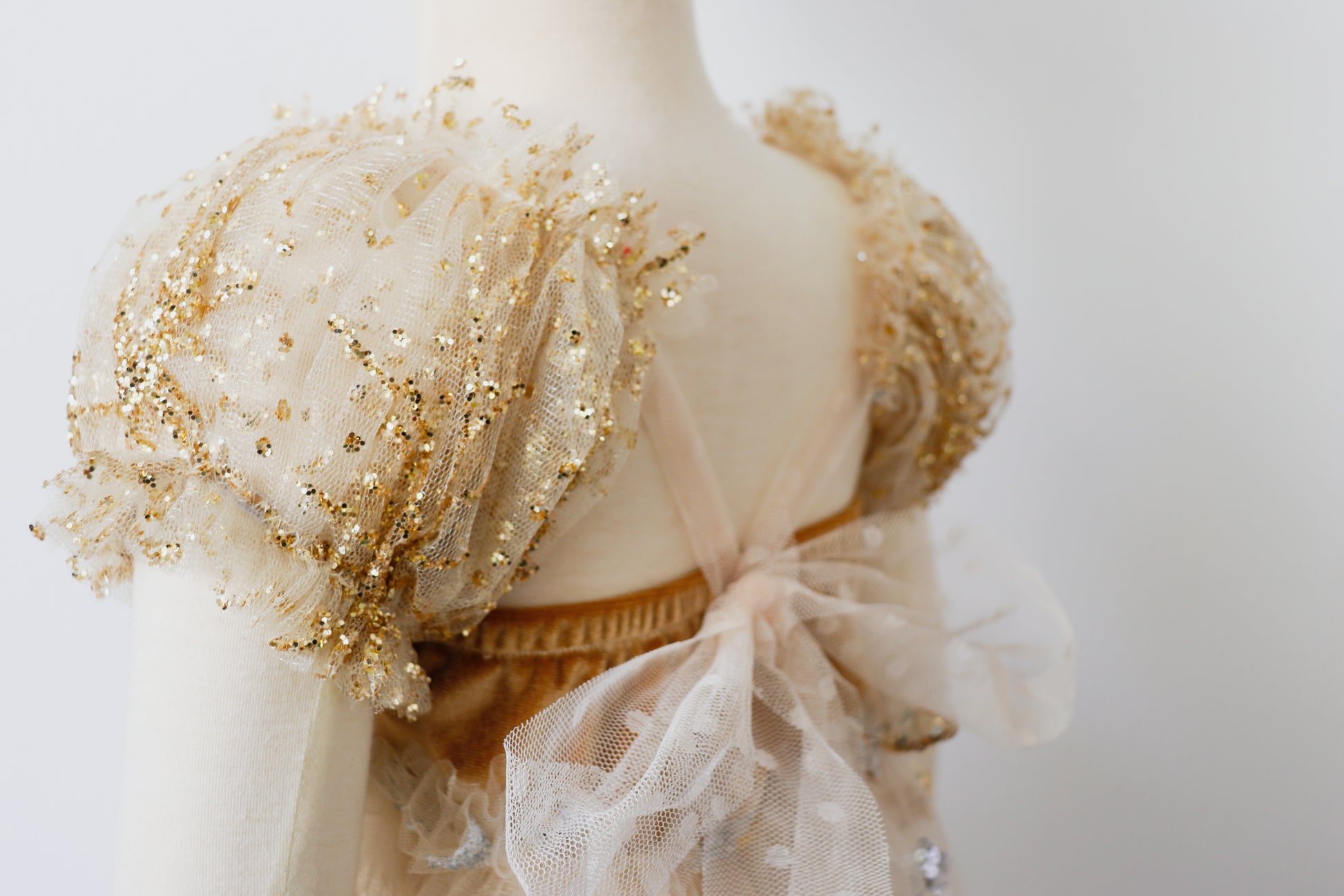 Elegant gold and tulle photography prop dress for girls with puffed sleeves and intricate embellishments