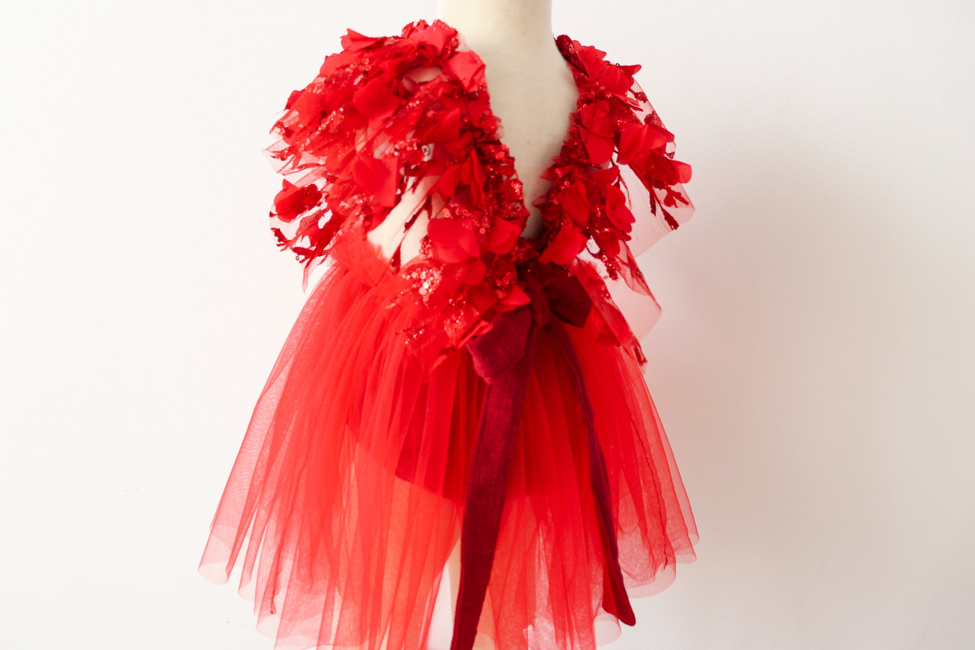 Red sitter photography dress by FLEUR MARGOT with floral lace details and tulle skirt