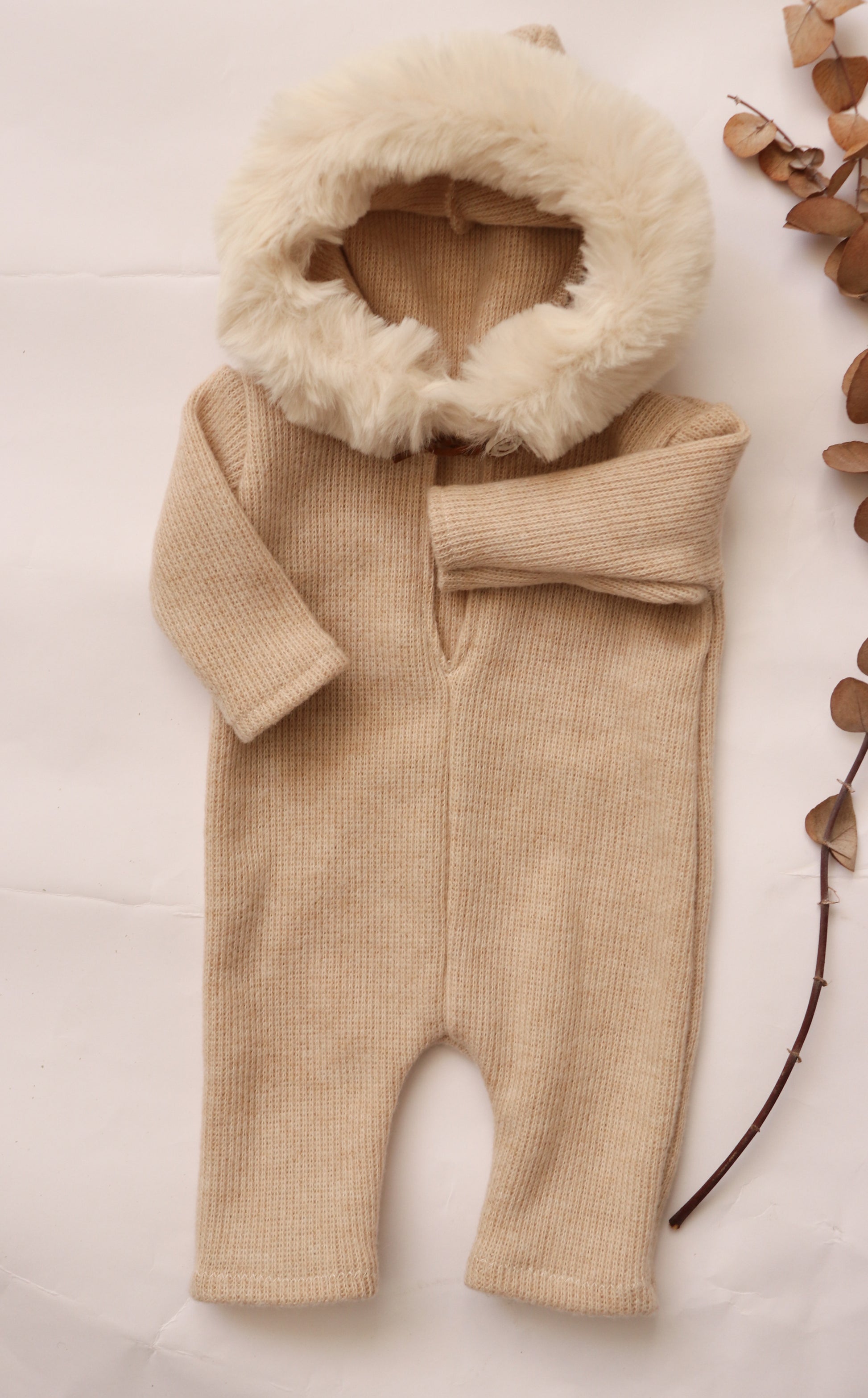 Soft cozy baby outfit for photoshoots in beige with a fluffy hood for adorable looks