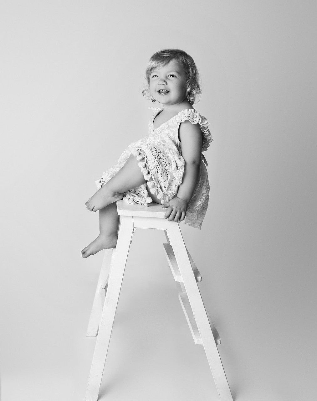 Boho girl’s dress with cross-over bodice and vintage lace, designed for outdoor sessions