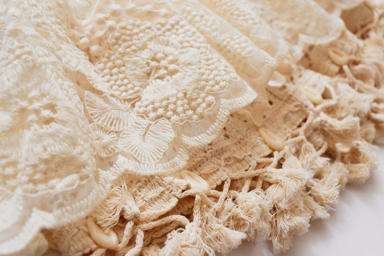 Stylish girl’s boho dress with shell fringe trim on the skirt, great for beach photoshoots.