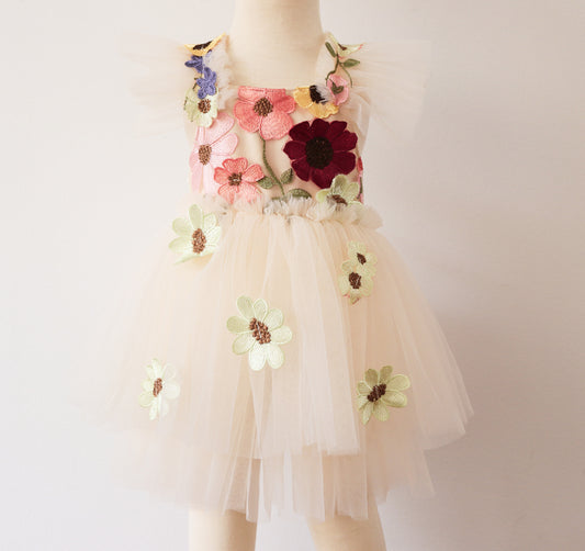 Elegant girl’s dress featuring a beige velvet bodice with floral embroidery, a double-layered ivory tulle skirt, and 3D embroidered flowers, perfect for spring photoshoots and birthday celebrations
