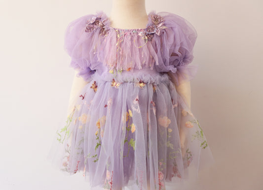Lavender tulle dress with puffy sleeves and floral embroidery, perfect for birthdays.