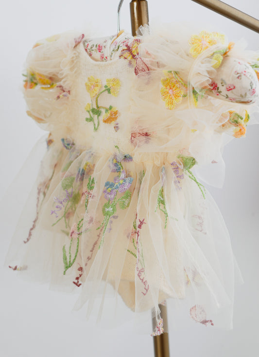 "Newborn girl romper dress in soft ivory mohair wool with floral embroidery"

