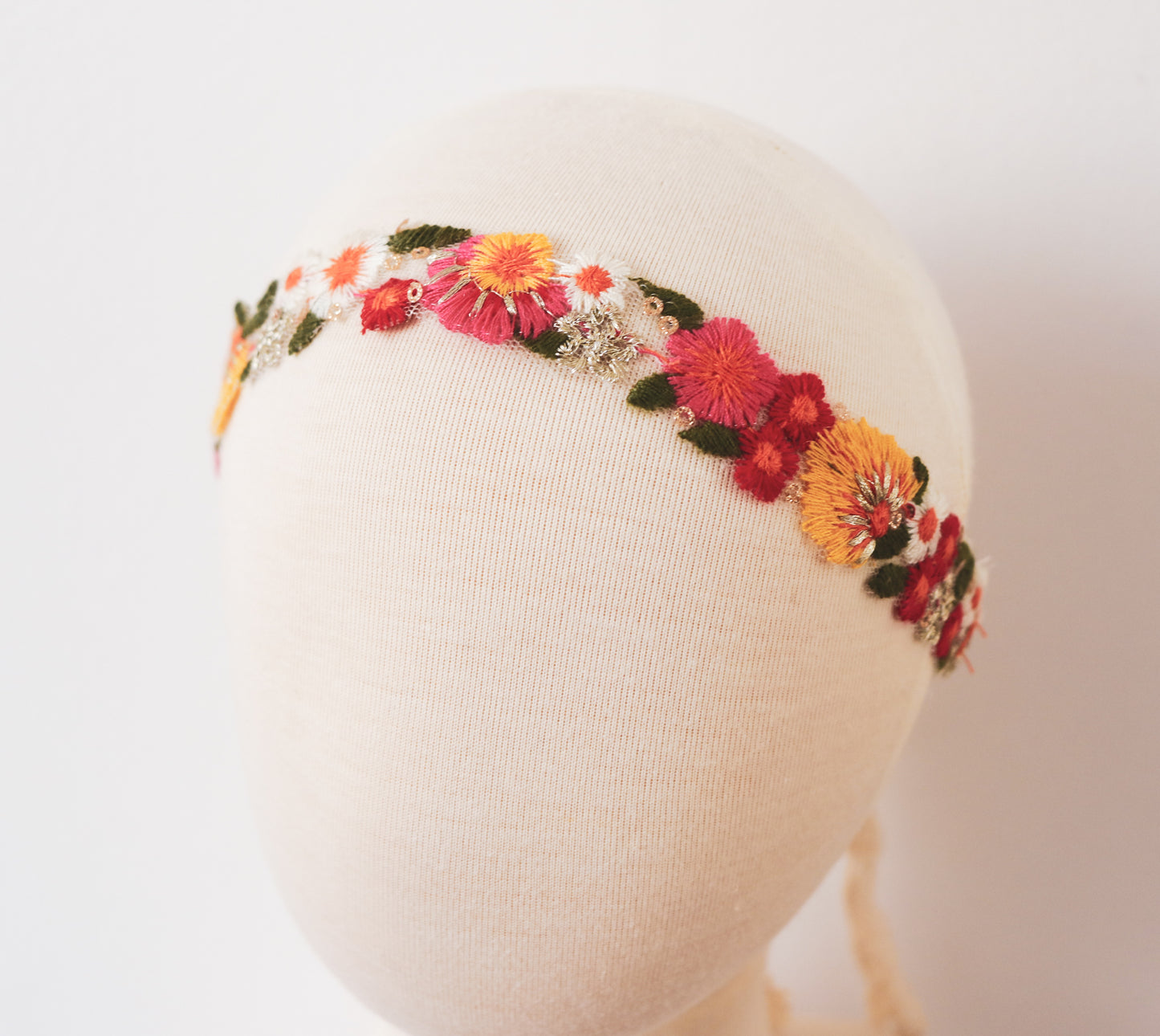 "Back view of a girl’s terracotta dress featuring a soft tie-back bow and delicate lace accents, perfect for boho-themed photoshoots."

