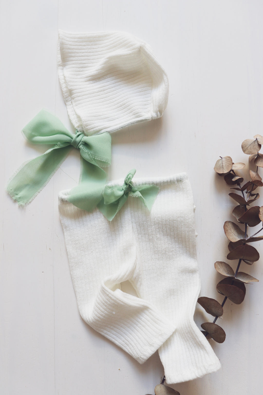 Newborn Romper Dress in White Wool with Pearl-Adorned Tulle and Sage Green Ribbon, Paired with Unisex Béguin and Pants