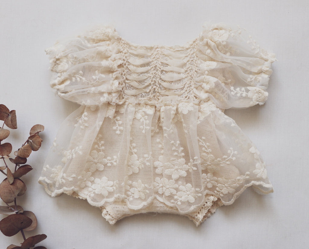 Cream lace newborn photo outfit with floral embroidery and puff sleeves by FLEUR MARGOT