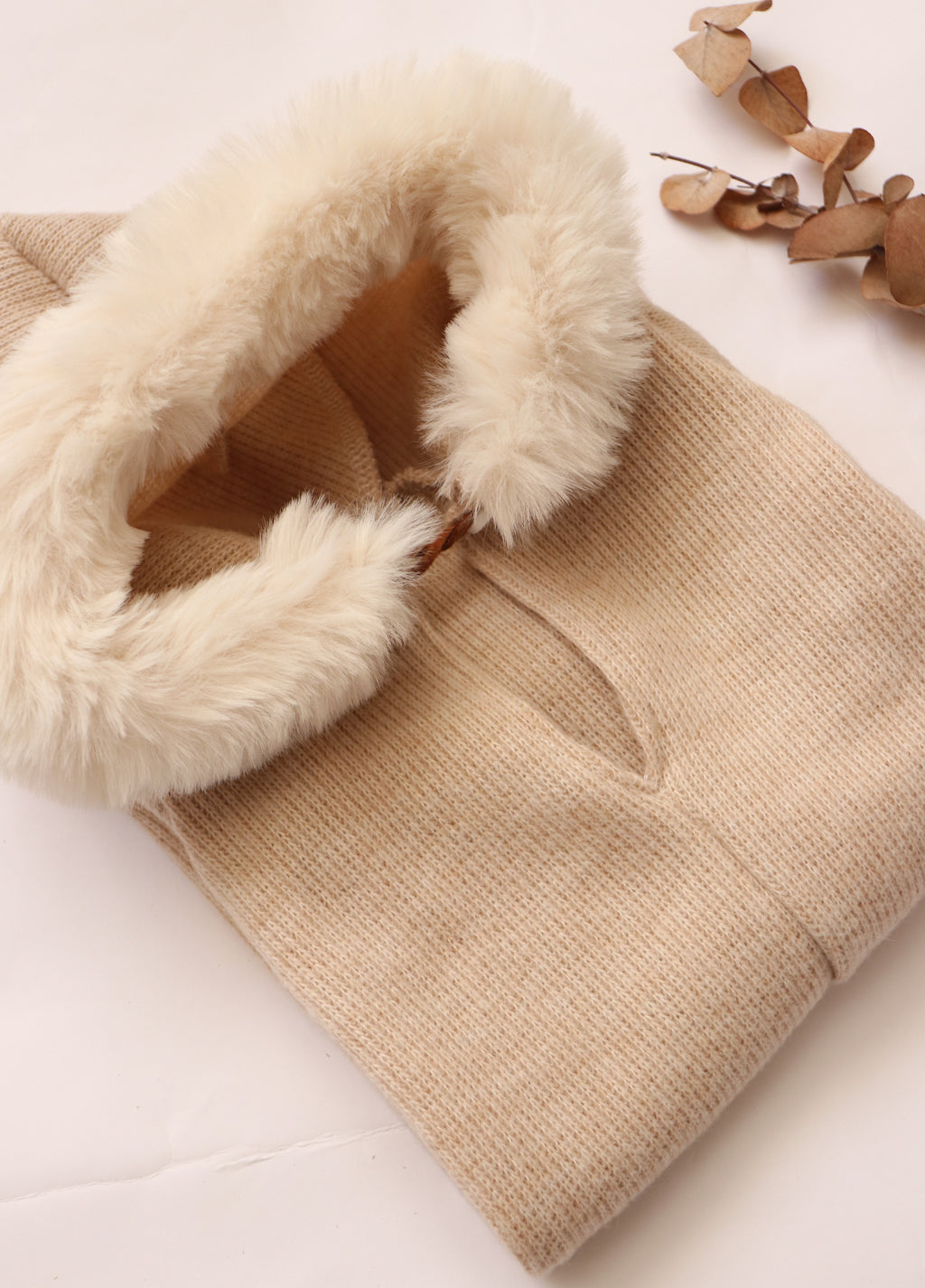 Soft cozy baby outfit for photoshoots featuring a warm, fluffy-lined hood in beige