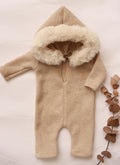 Soft cozy baby outfit for photoshoots featuring a plush hood and ribbed texture in beige