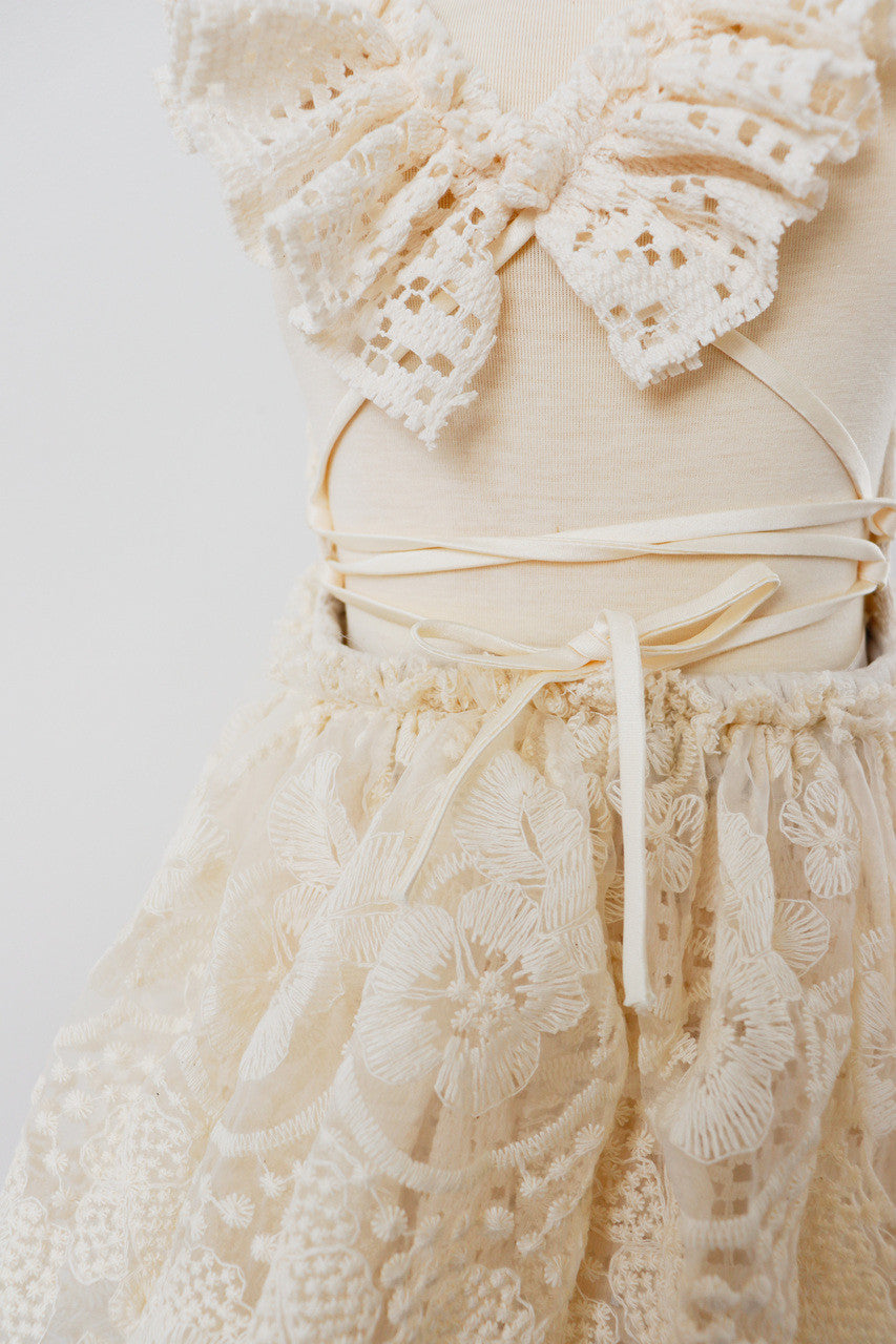 Boho-style dress with adjustable strappy cross-back and gathered waist for outdoor sessions